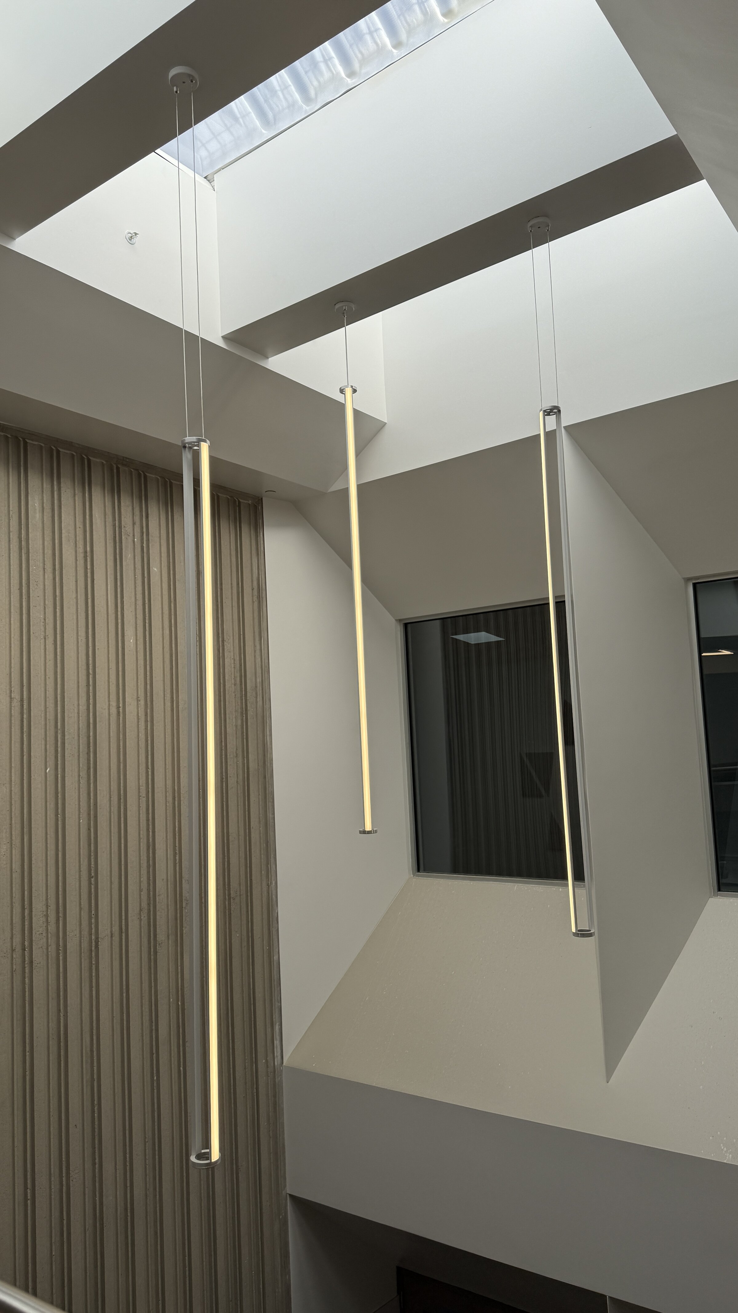 Lakeview Jr High interior suspended light pillars from skylight