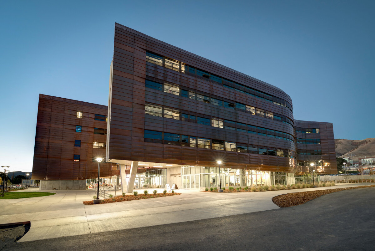 Lassonde Studios copper facade at twilight